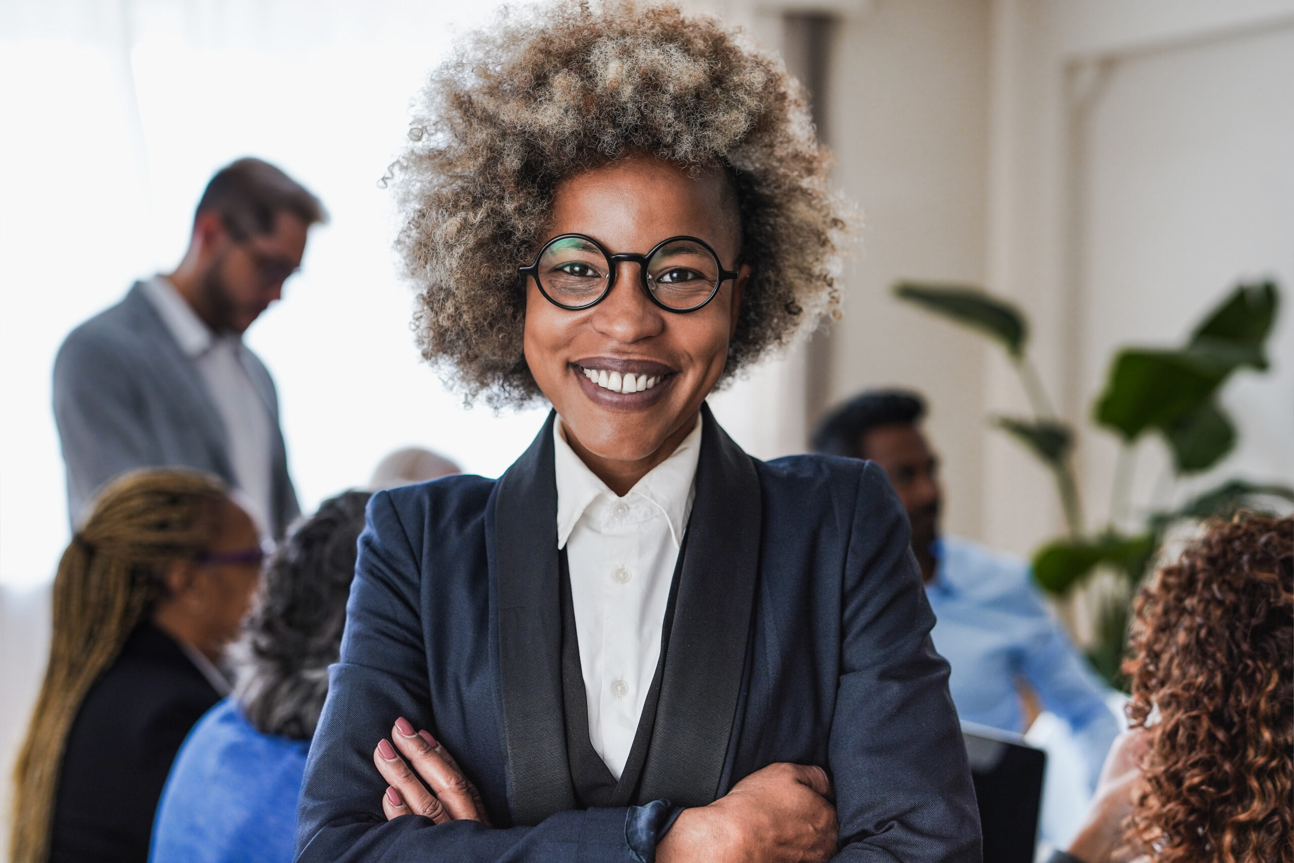 A confident team leader with a welcoming smile, representing professionalism and a powerful leadership mindset.