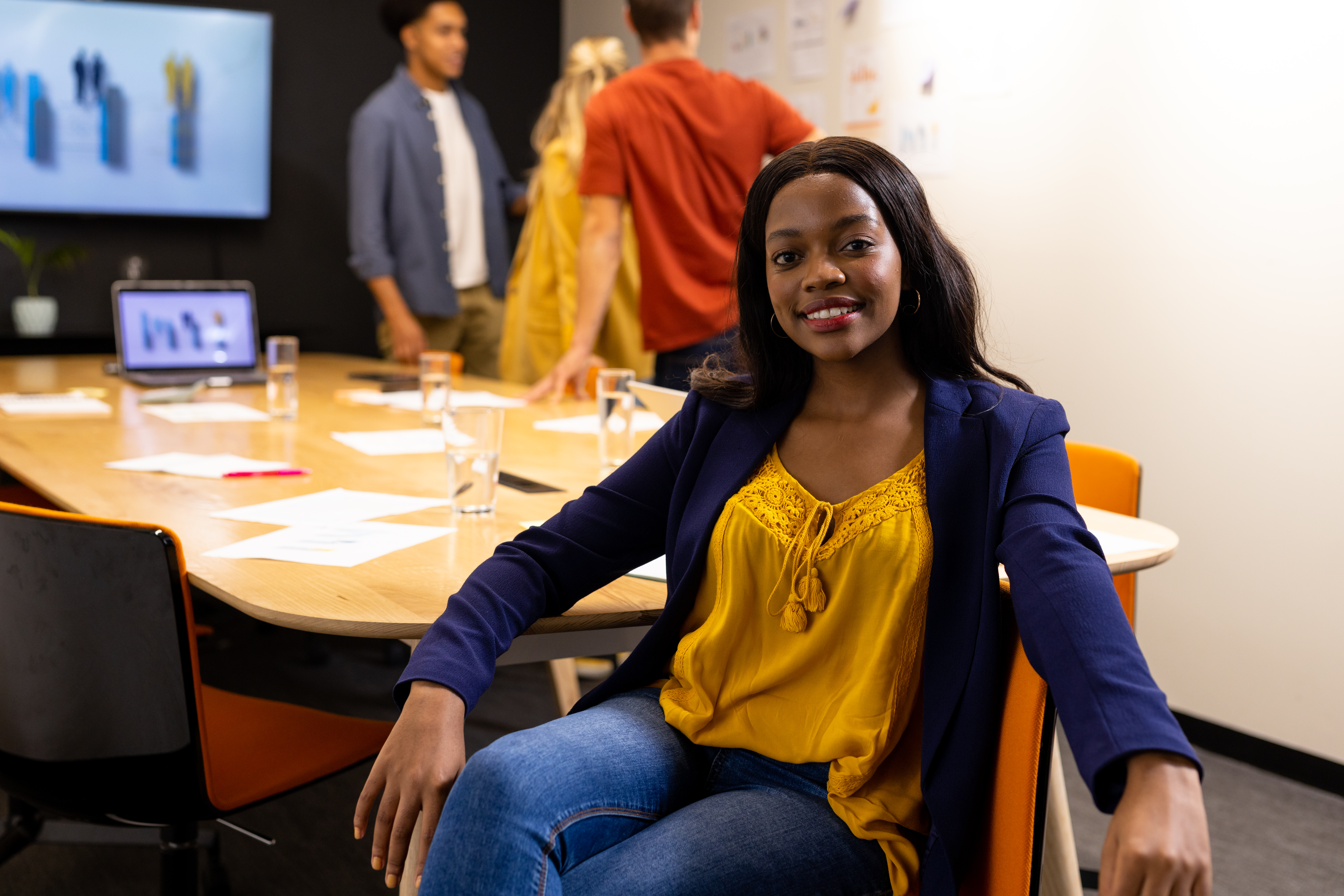 A professional marketing intern building experience in a modern workplace environment.